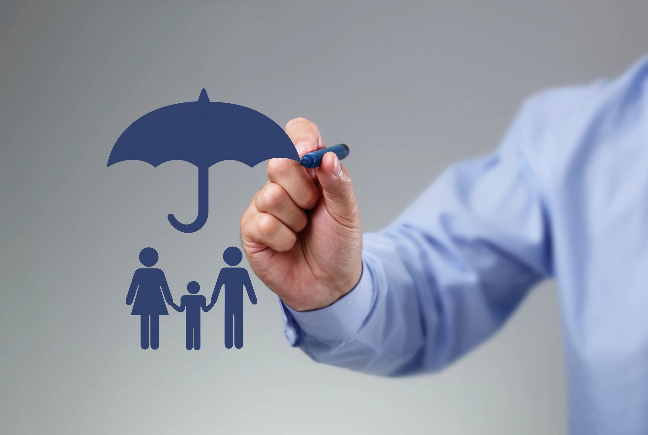Hand drawing umbrella over family icons